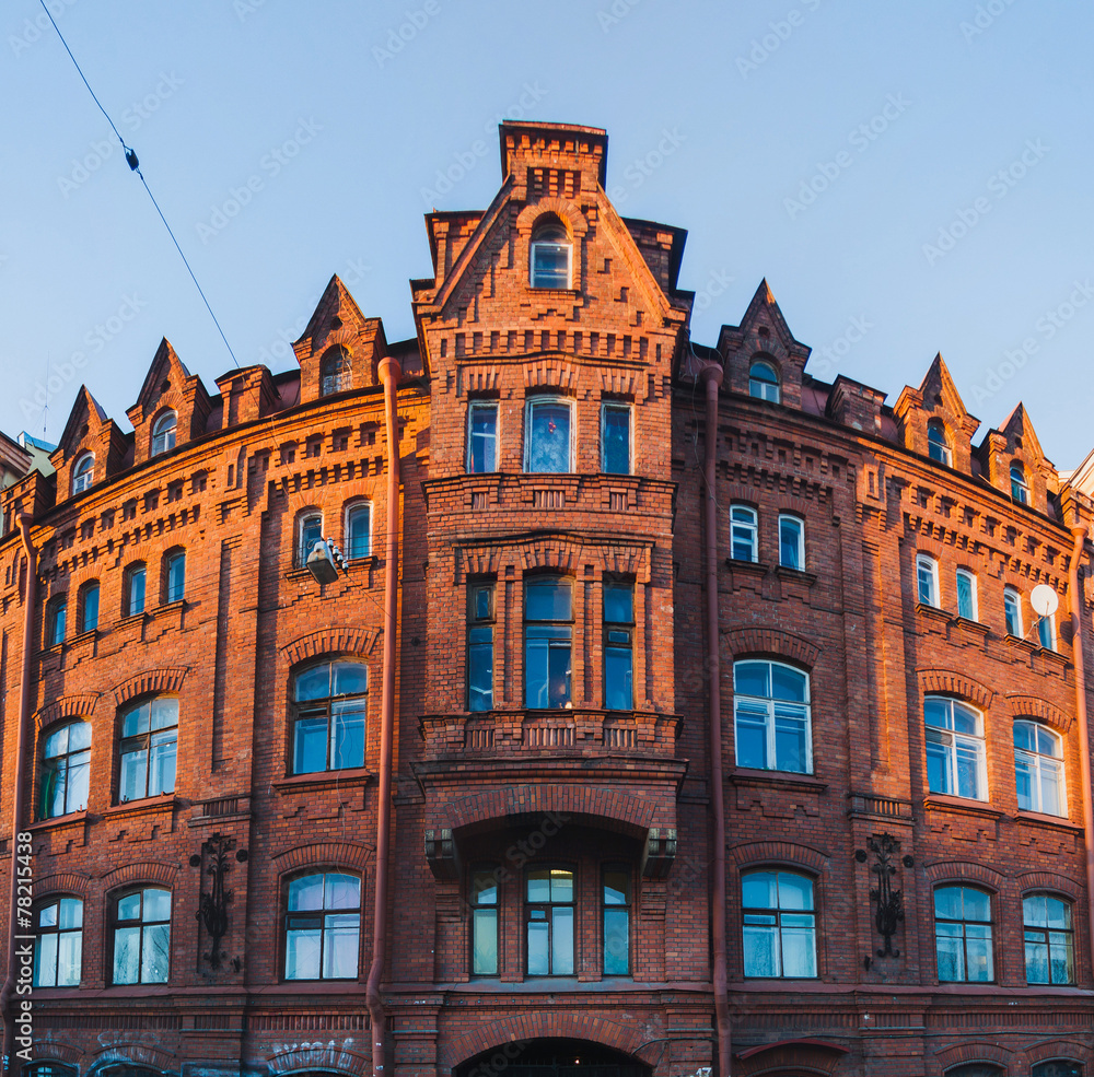 Fototapeta premium Panoramic view of an old red brick building near New Holland Isl