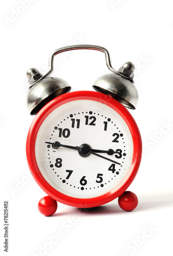 red alarm clock with white dial