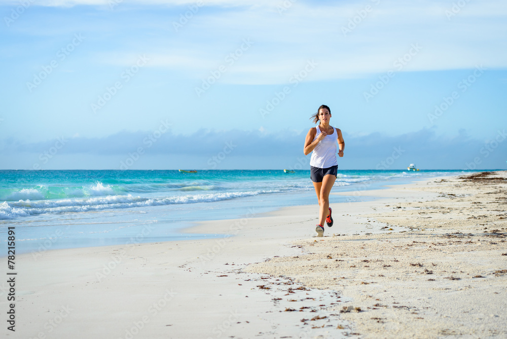 Woman running at tropical beach