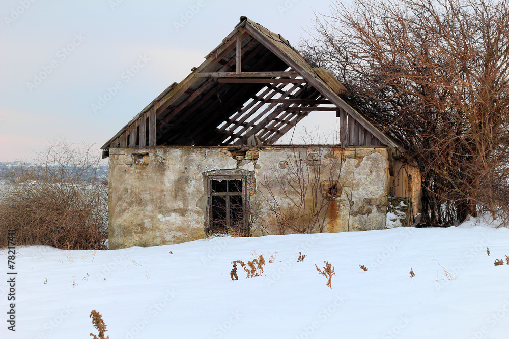 Collapsed old house in winter season