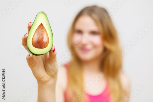 Unrecognizable woman with avocado