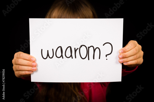 Child holding sign with Dutch word Waarum - Why