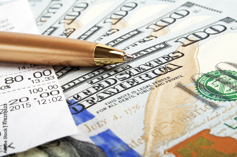 Business concept - money, pen and cash voucher Business concept - money, pen and cash voucher