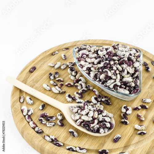 Bean seeds on wooden board. Healthy vegetarian food.