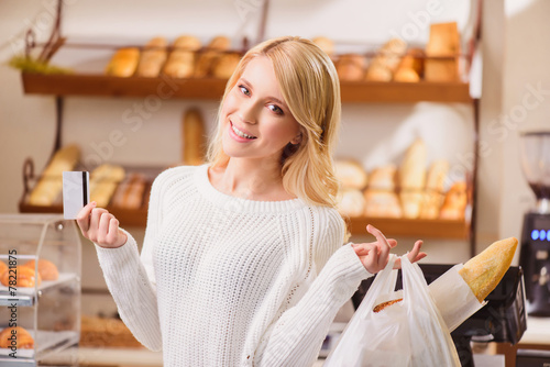 Beautiful young woman in a bakery