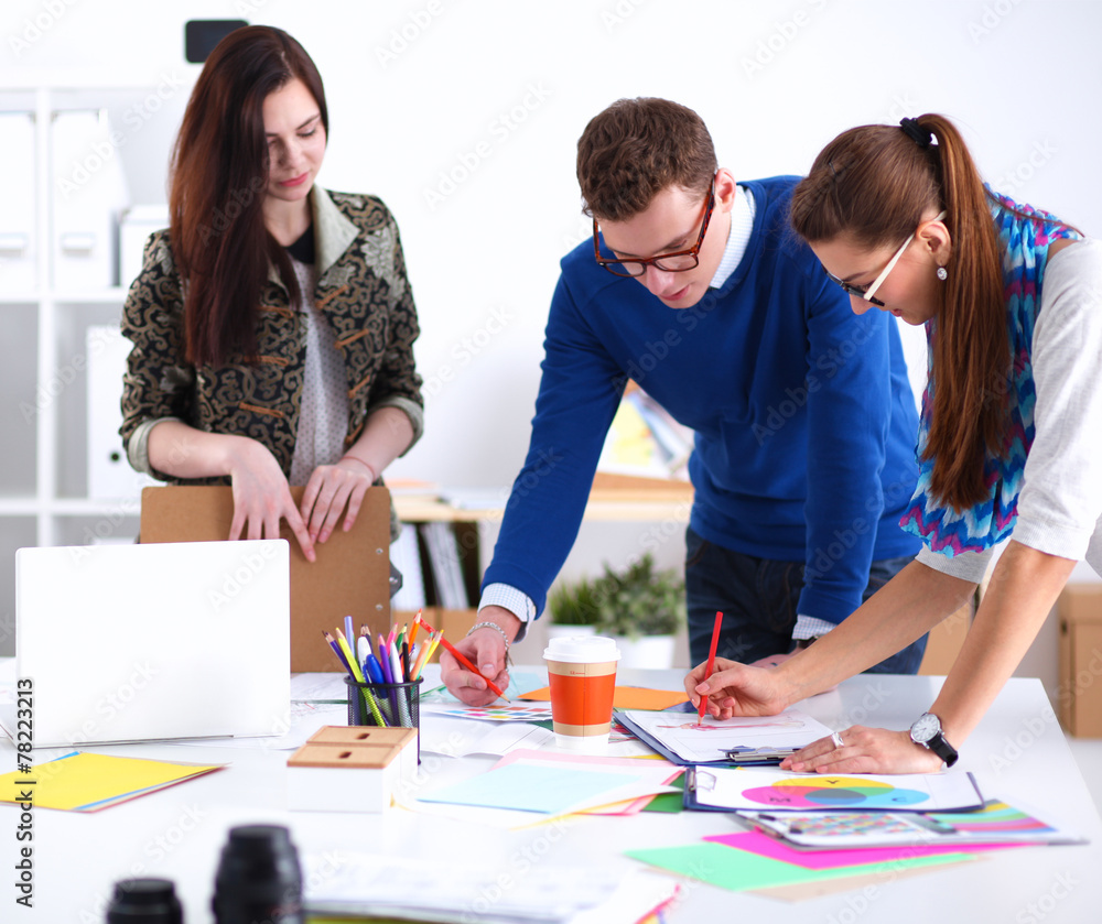 Young business people working at office on new project Young business people working at office on new project