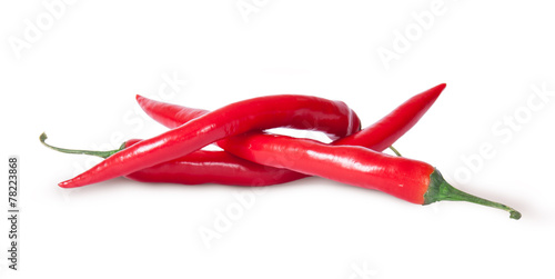 Pile of three red chili peppers