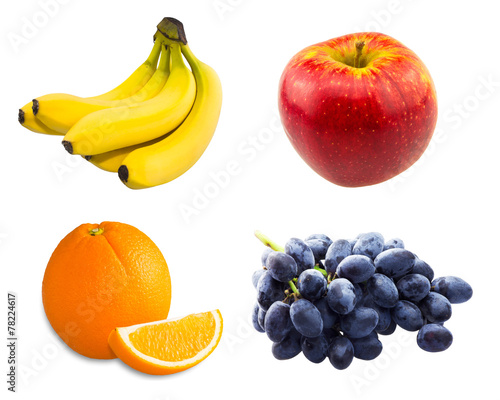 Branch of blue grapes , bananas, sliced orange and red apple
