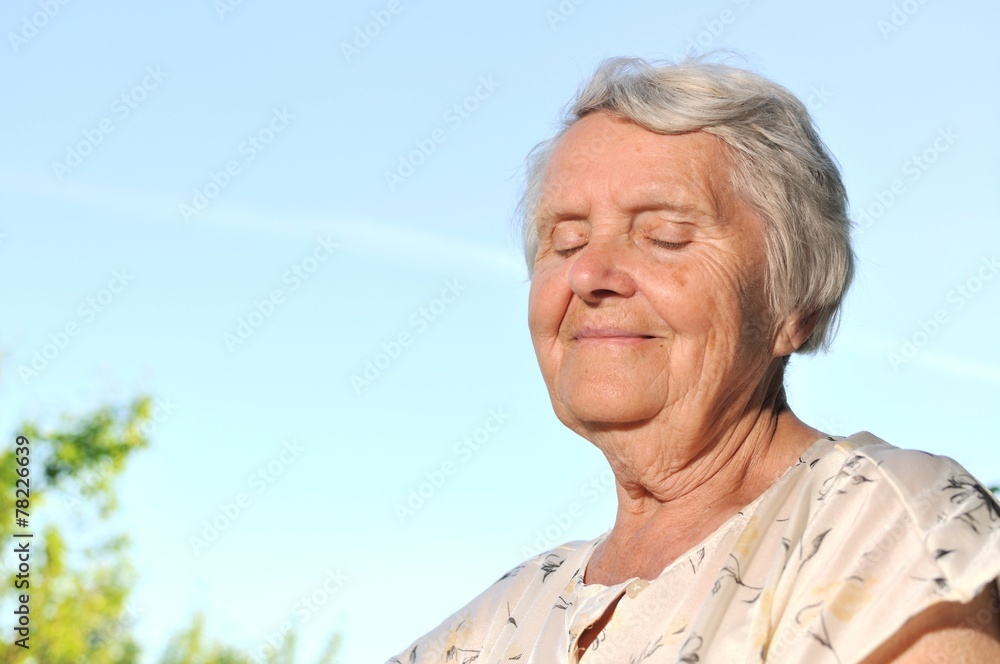 Senior happy woman on blue sky. Senior happy woman on blue sky.