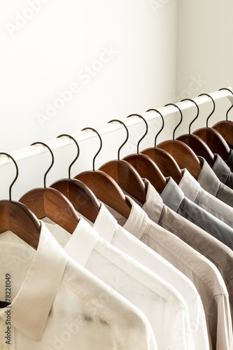 Several shirts on a hanger with copy space