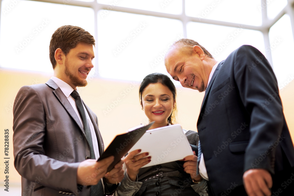 business team discussing something in office business team discussing something in office