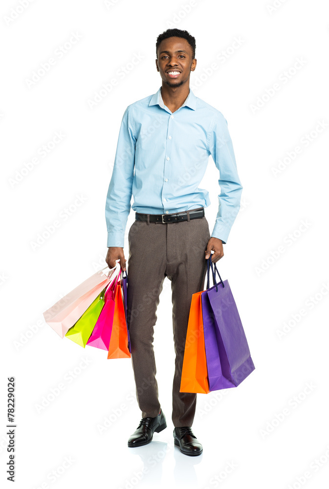 Happy african american man holding shopping bags on white backgr Happy african american man holding shopping bags on white backgr