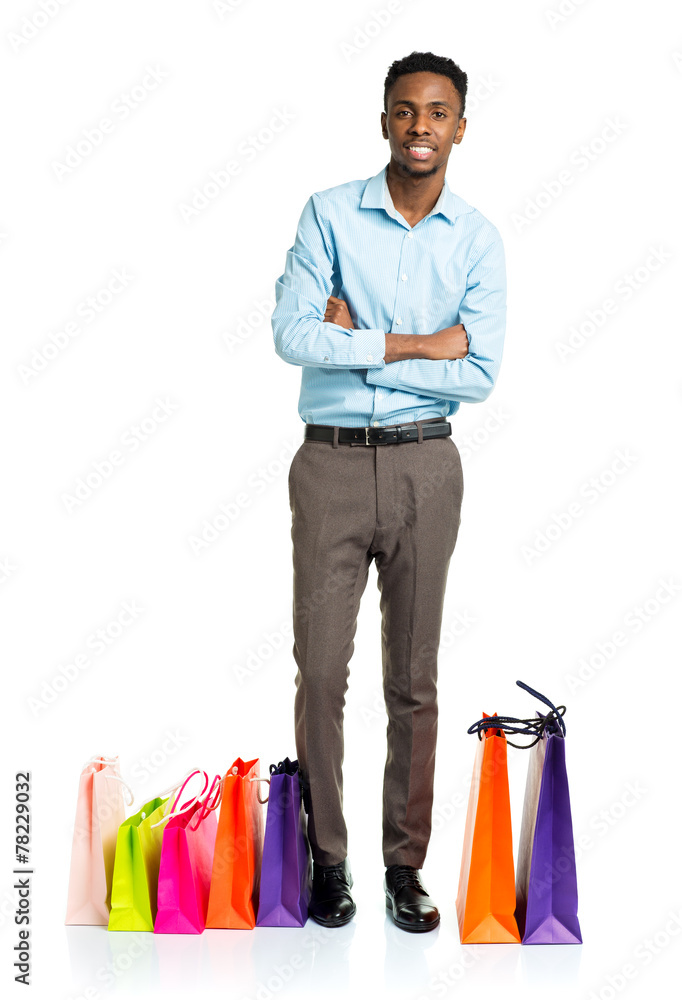 Happy african american man with shopping bags on white backgroun Happy african american man with shopping bags on white backgroun