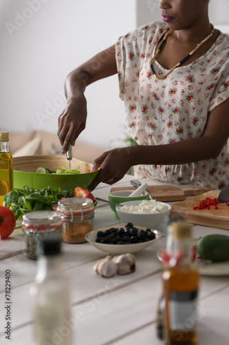 Young African Woman Cooking Salad