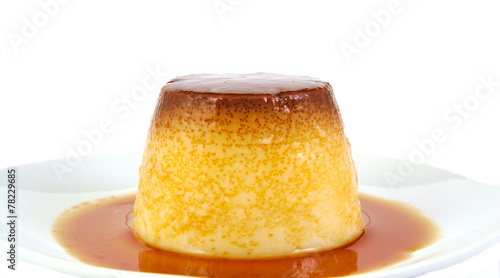 Creme caramel, custard or pudding isolated on white background photo