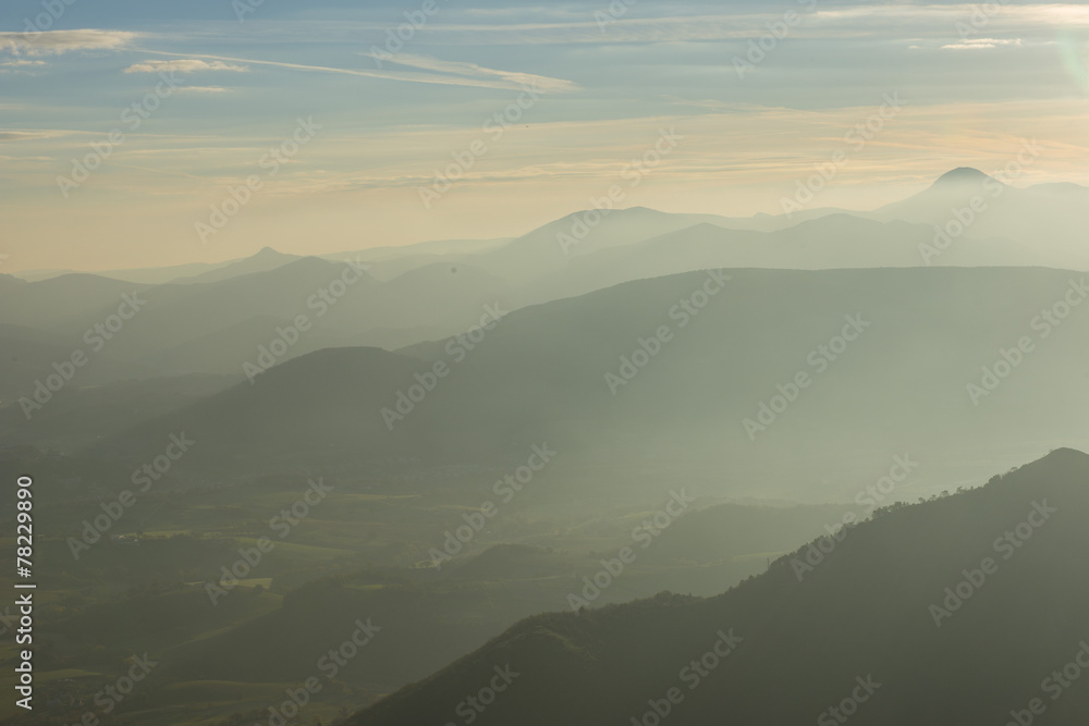 Sunrise on Apennines with fog, blue sky with clouds, Marche, Ita