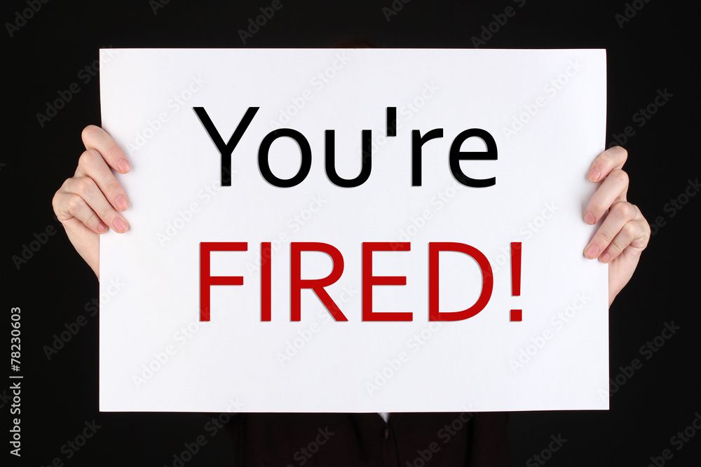 Sheet of paper with text You're Fired in hands isolated on Sheet of paper with text You're Fired in hands isolated on
