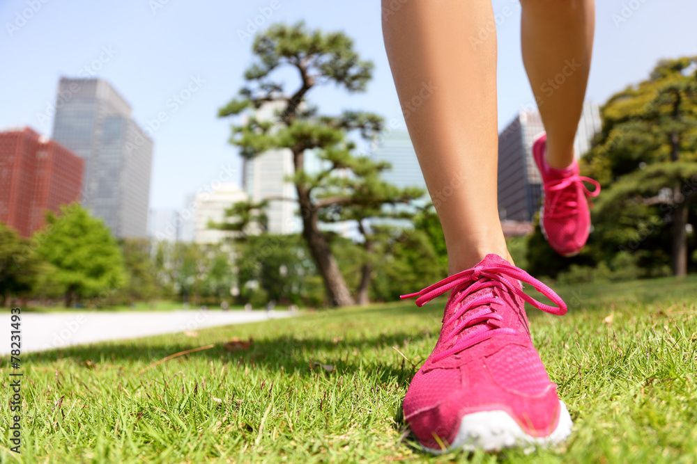 Running shoes - woman jogging in Tokyo Park, Japan