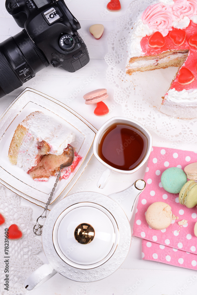 Different sweets and photo camera on table top view Different sweets and photo camera on table top view