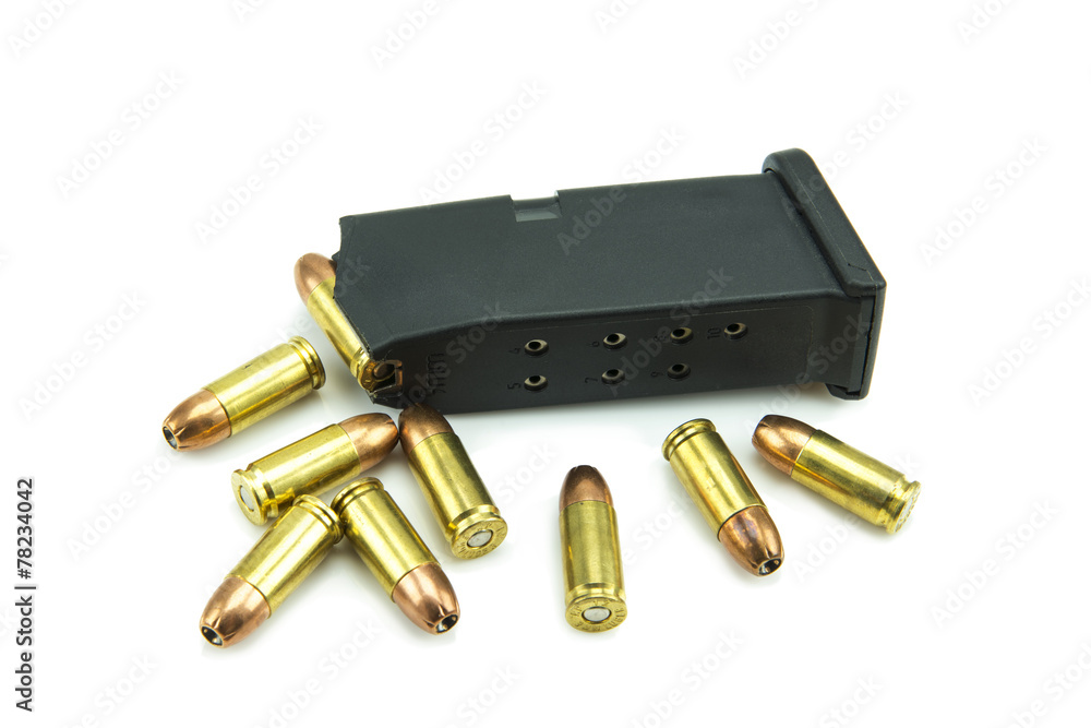 9mm bullets and magazine isolated on white background.