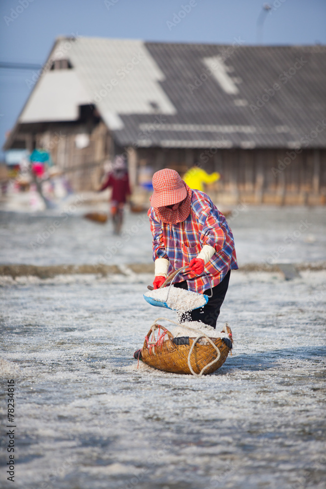 Farmer working in the salt field in Thailand