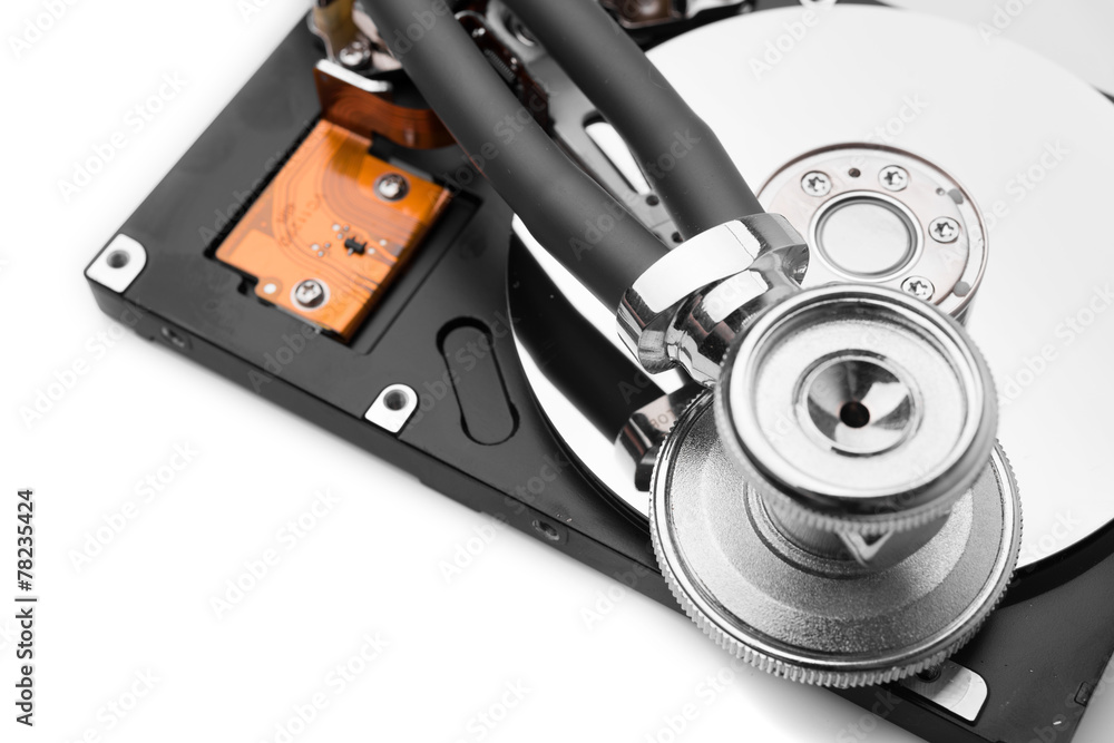 stethoscope on the hard disk drive over white stethoscope on the hard disk drive over white