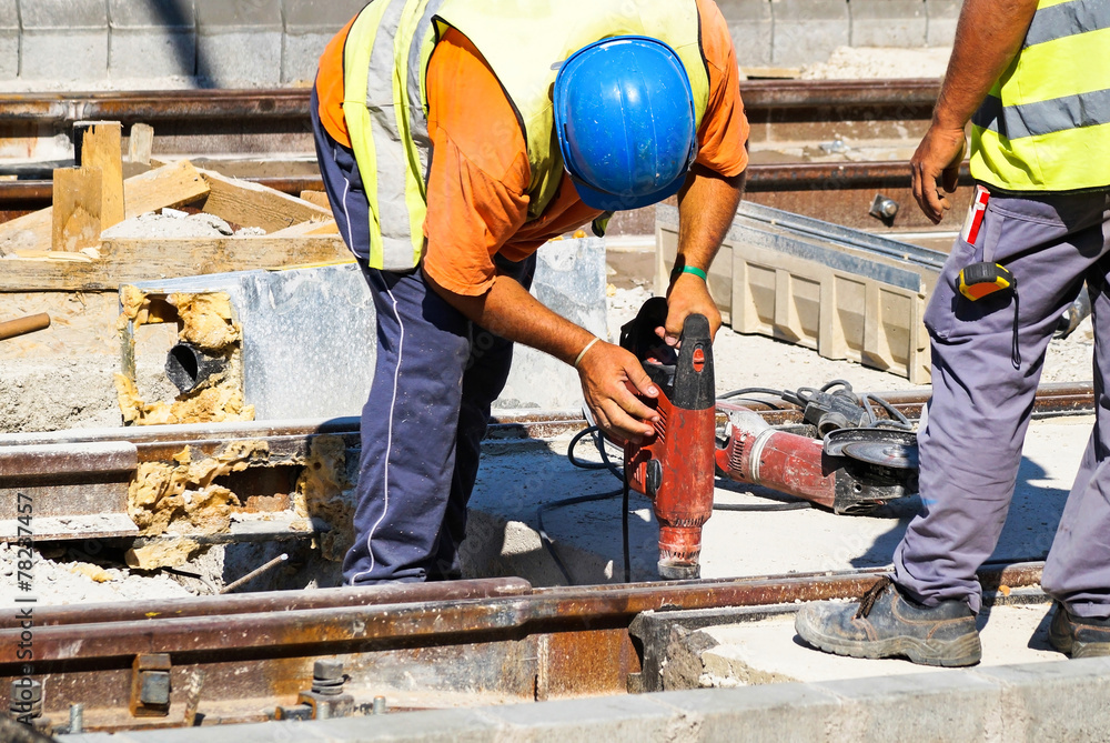 Men are working at the railway construction Men are working at the railway construction