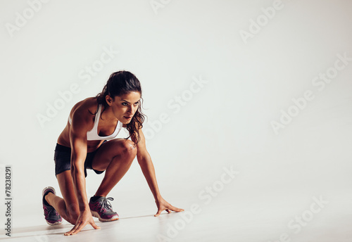 Focused woman ready for a run