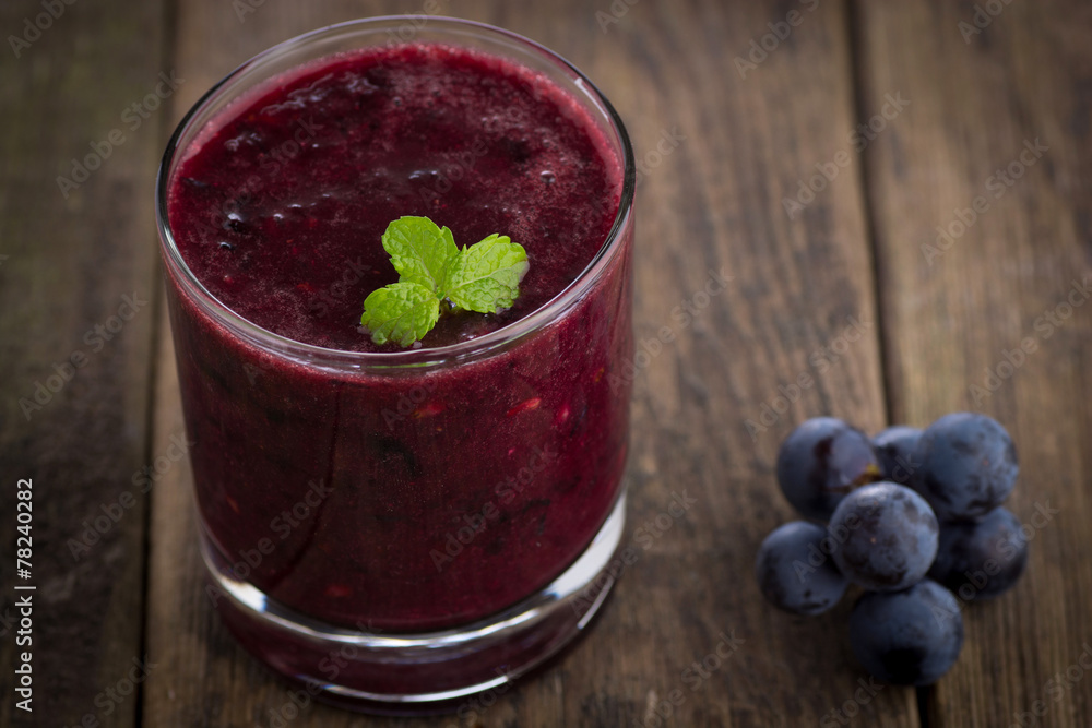 Glass of Grape Juice smoothie on wooden background Glass of Grape Juice smoothie on wooden background