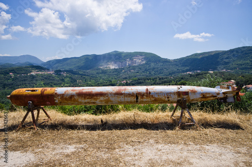 Old torpedo as monument in village - Corfu, Greece