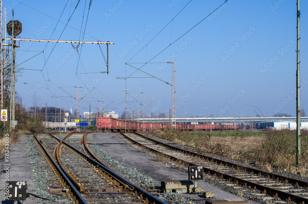 Railway tracks with freight train Railway tracks with freight train