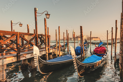 Gondolas docked to the poles on the Grand Canal in Venice. © Jarek Pawlak
