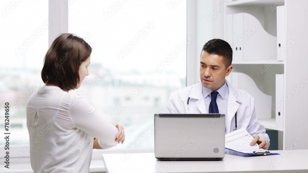 smiling doctor and young woman meeting at hospital smiling doctor and young woman meeting at hospital