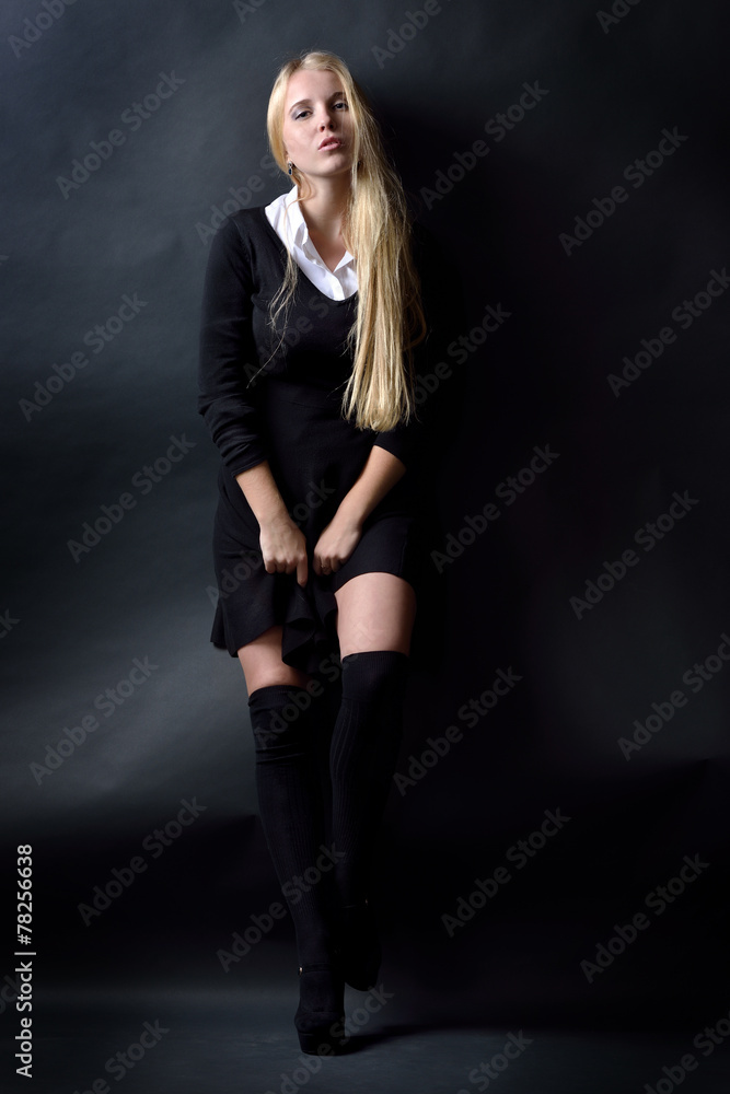 Beautiful sexy woman in black dress and stockings Beautiful sexy woman in black dress and stockings