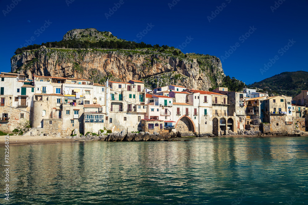 old houses and the mountain on a background in Cefalu