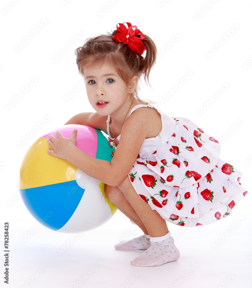 pretty little girl with big inflatable ball. pretty little girl with big inflatable ball.