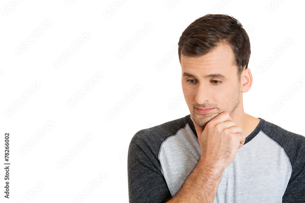 Portrait of a thoughtful sad man looking down Portrait of a thoughtful sad man looking down