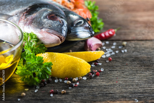 Fototapeta Naklejka Na Ścianę i Meble -  Food background of fresh fish with herbs,cooking concept
