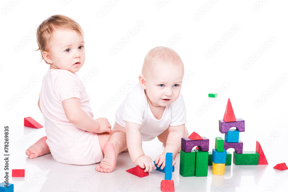 Beautiful babies building with cubes Beautiful babies building with cubes