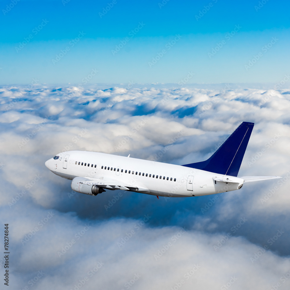 Passenger airliner flight in the blue sky