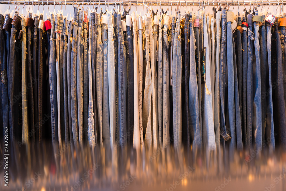 Clothes hanging on a rail in a shop