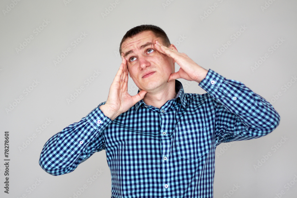 Young man having headache Young man having headache