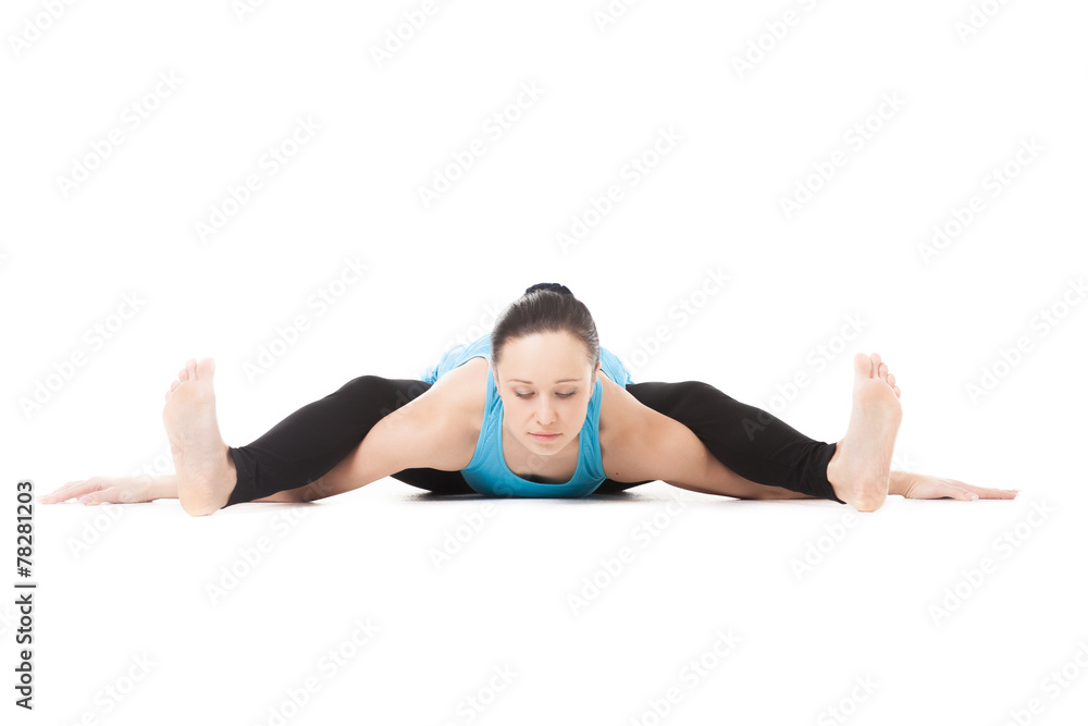 Yogi female in yoga asana Tortoise Pose Yogi female in yoga asana Tortoise Pose