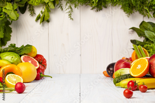 Fototapeta Naklejka Na Ścianę i Meble -  Fruit and vegetable borders on wood table