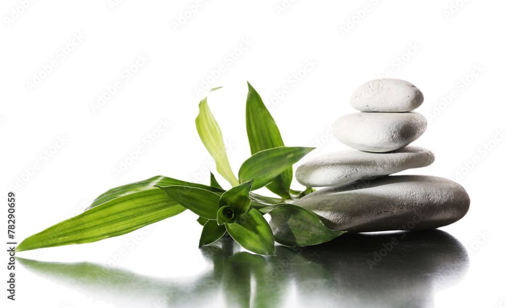 Still life of spa stones on glossy surface isolated on white Still life of spa stones on glossy surface isolated on white