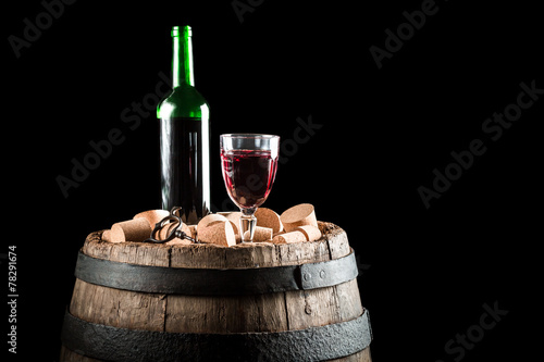 Fototapeta Naklejka Na Ścianę i Meble -  Old wooden barrel and a glass of red wine