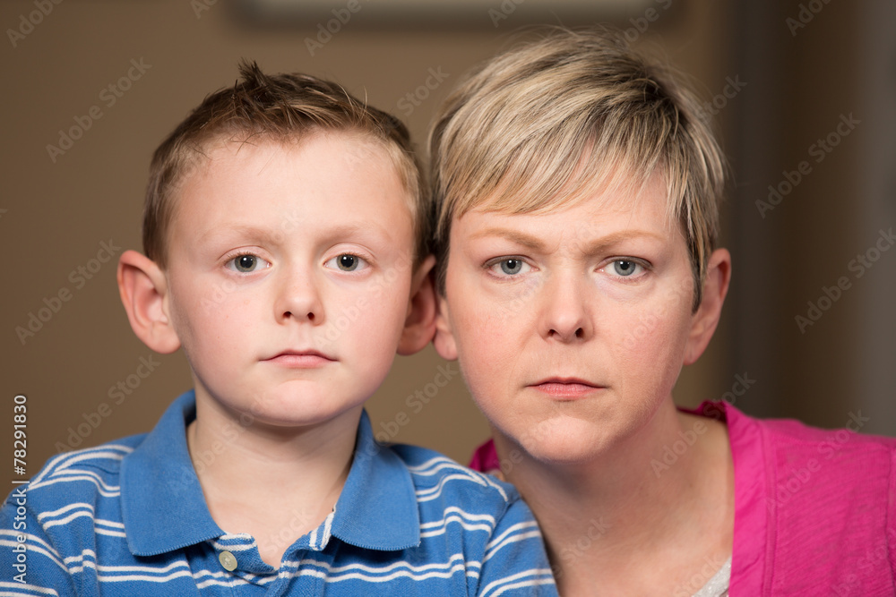 Serious portrait of mother and young son. Serious portrait of mother and young son.