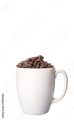Roasted coffee bean in white mug