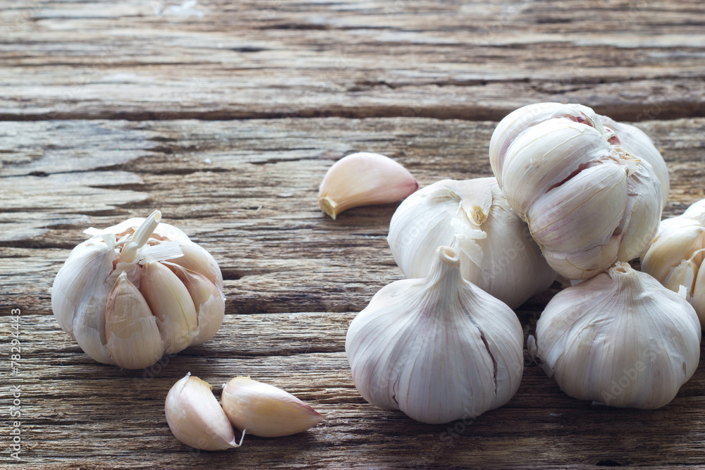 Garlic on the wooden background Garlic on the wooden background