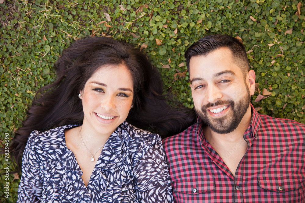 Fototapeta premium Young couple relaxing at a park
